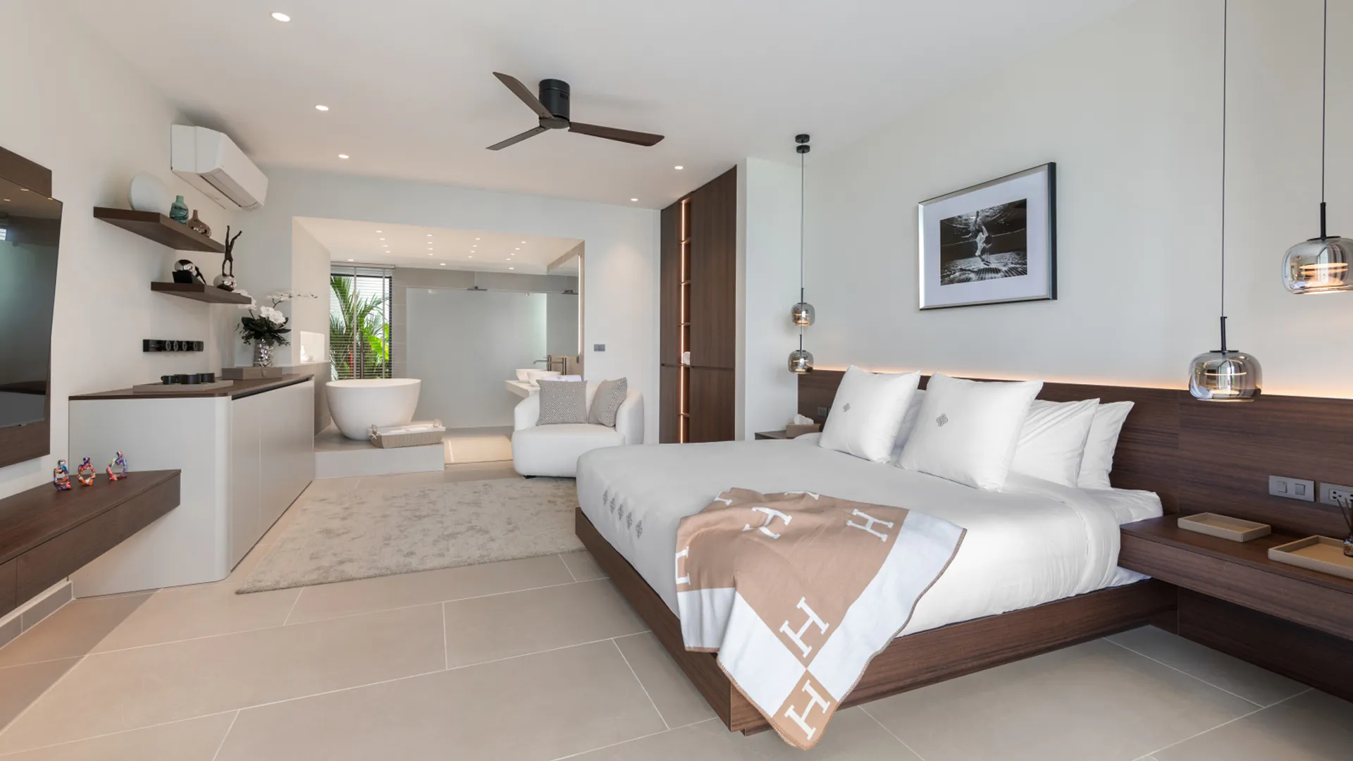 Luxury Master Bedroom with Ensuite Bathroom - Emotion Beach Villas Spacious master bedroom suite at Emotion Beach Villas with king bed, ensuite bathroom, and modern tropical design.
