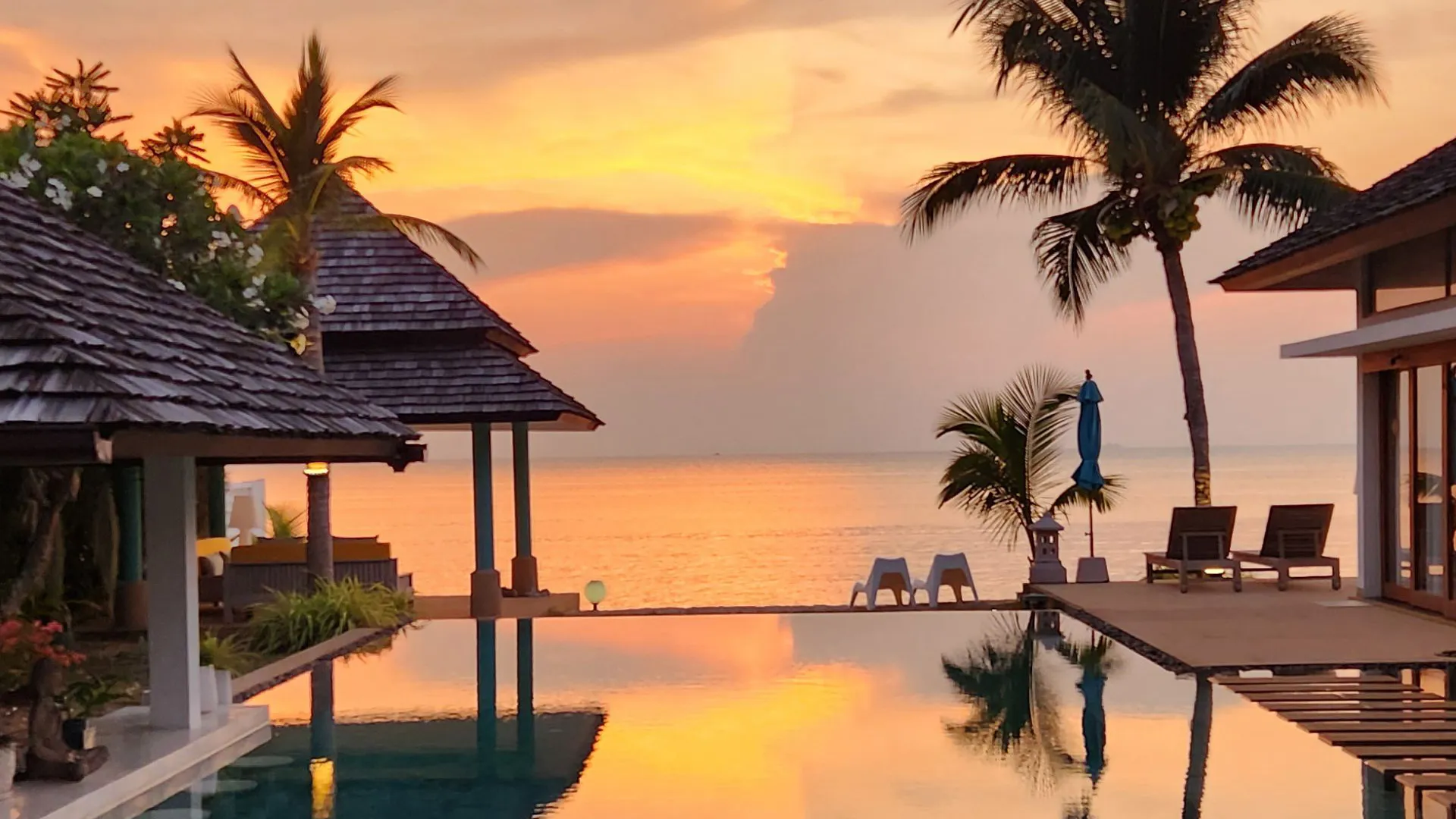 Secluded Thai Villa with a Panoramic Sunset Sea View An aerial view of a secluded Thai villa on a cliff, demonstrating a perfect micro-location with total privacy and a panoramic sunset sea view.