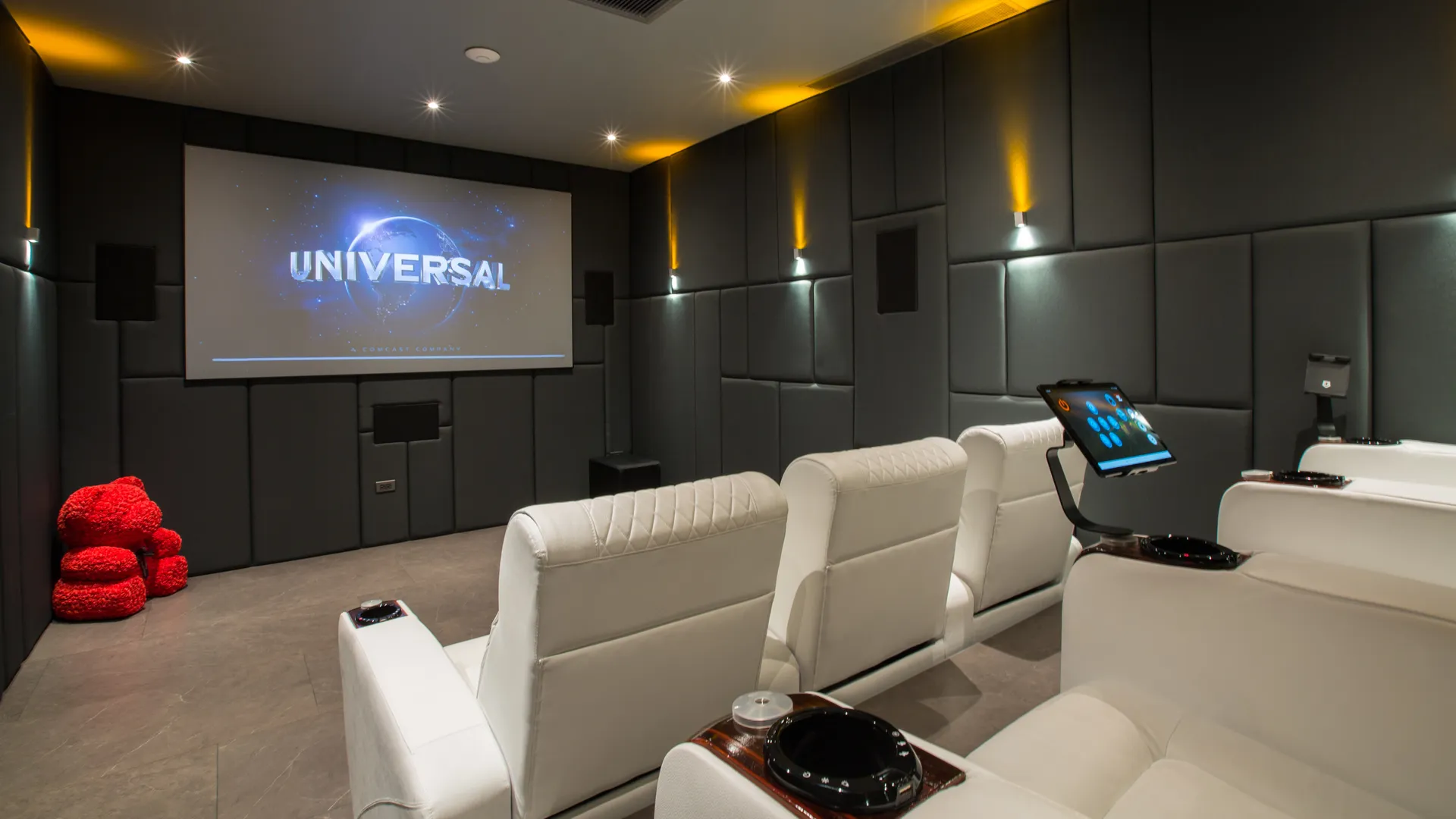 Ultra-Luxury Villa Facility Private Cinema Luxury private home cinema in a Thai villa, featuring plush reclining seats, advanced smart controls, and a large projection screen for an exclusive movie experience.